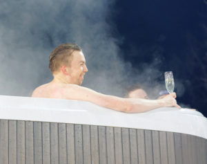 Man drinking champagne in a VIP hot tub at the Alpine Audi FIS Ski World Cup - city event January 31 2017 Stockholm Sweden